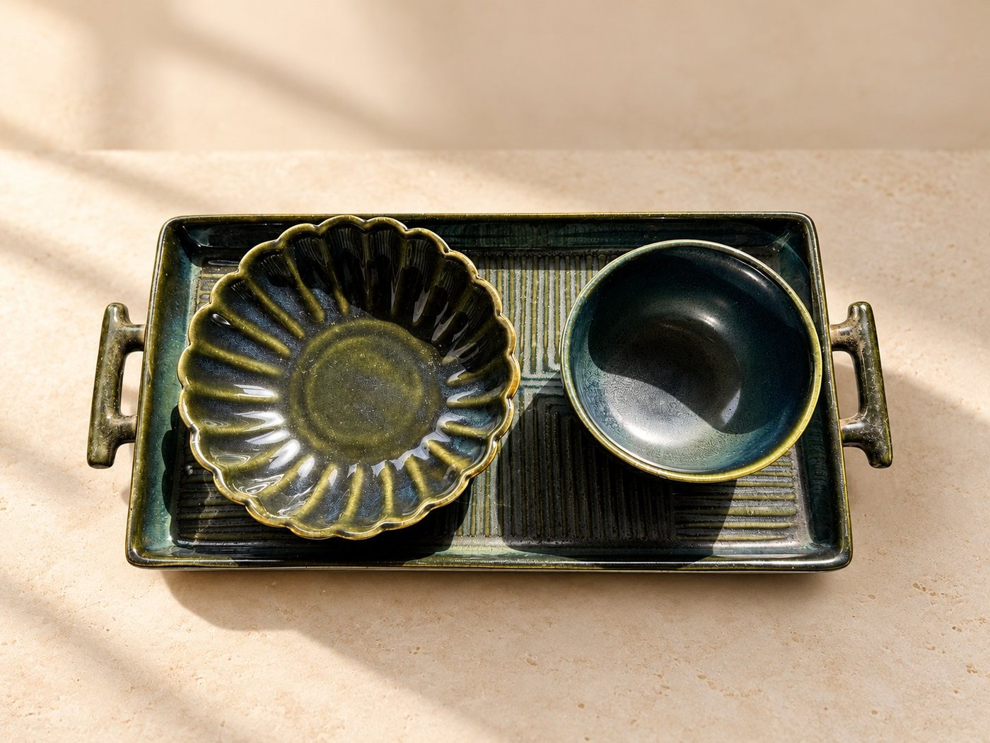 Fluted ceramic bowl and deep cup on a matching charcoal tray